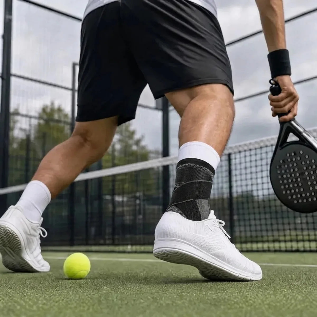 Foot Sleeve worn with sneakers during a padel match