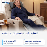 Man relaxing on the massage mat in a recliner: auto shut-off and 100-day guarantee