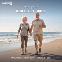Older couple walking on a beach, the man wearing a knee compression sleeve – get your mobility back