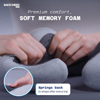 Hands pressing the soft memory foam of the travel pillow