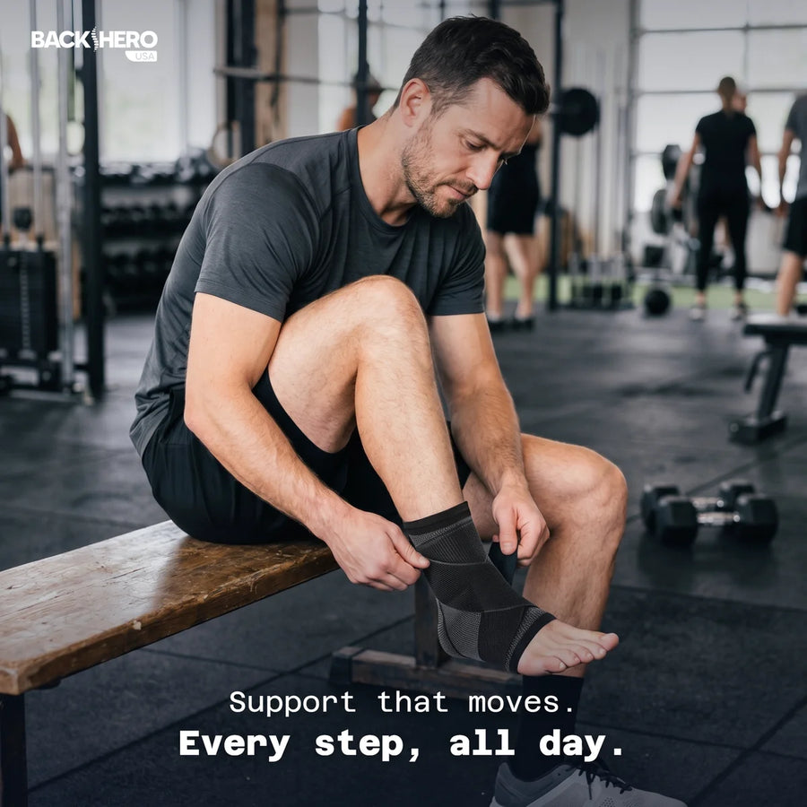 Man in a gym pulling on the black Back Hero USA Foot Sleeve before a workout