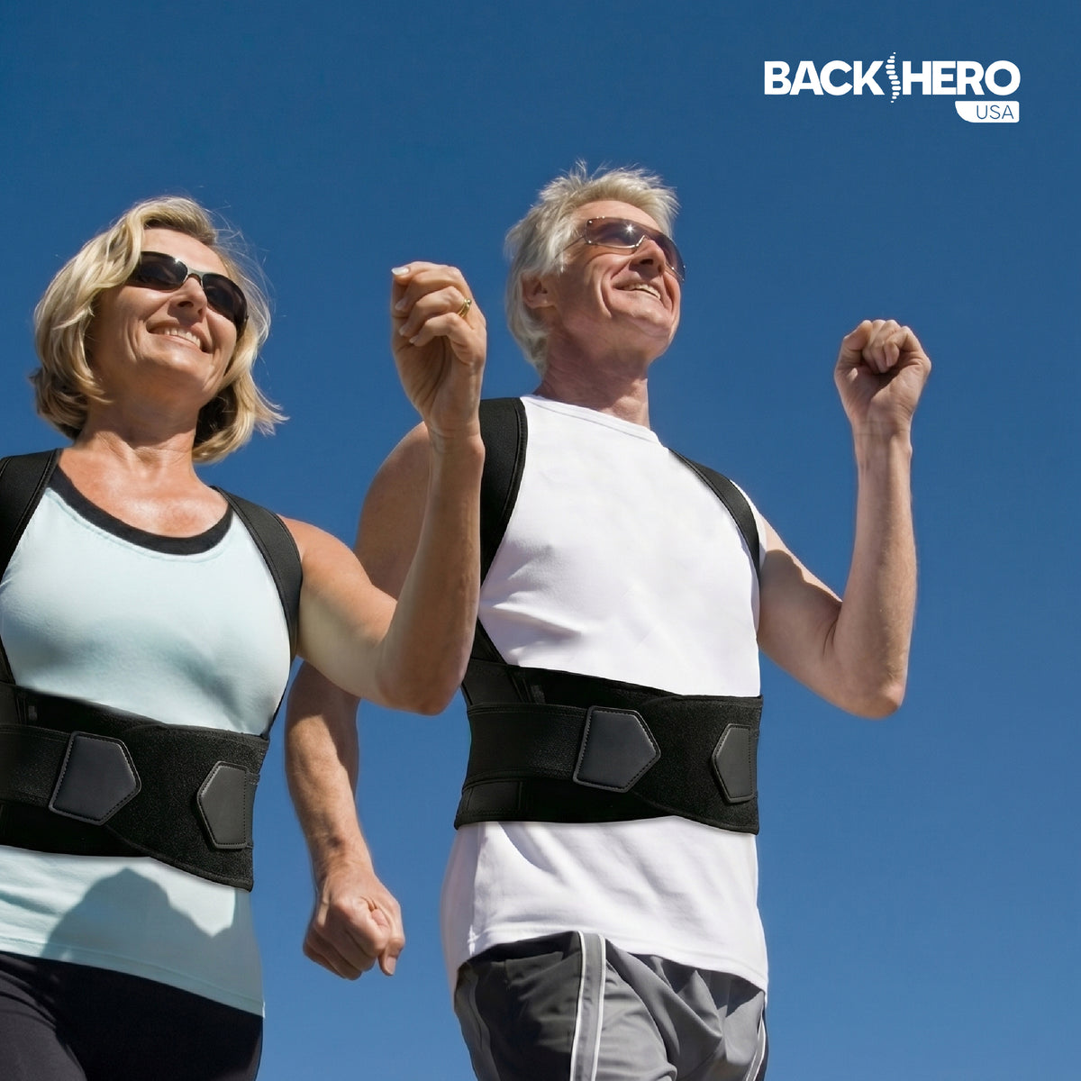 Couple walking outdoors wearing posture correctors